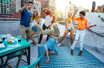 Rear view of people sitting on the floor