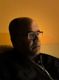 Close-up portrait of man with eyeglasses