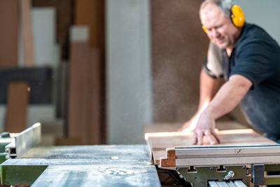 Portrait of man working on table