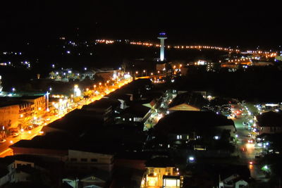 High angle view of illuminated buildings in city at night