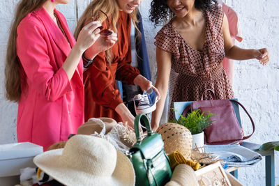 Female friends shopping at market