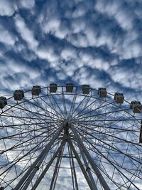 Low angle view of ferris wheel against sky