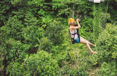 Man jumping in forest