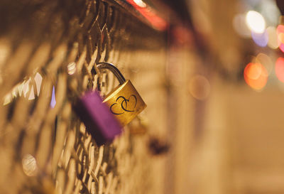 Close-up of padlocks on railing