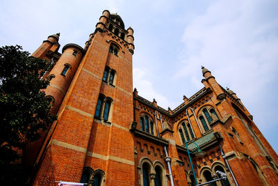 Low angle view of old building against sky