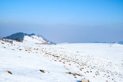 Scenic view of snow covered mountains against sky