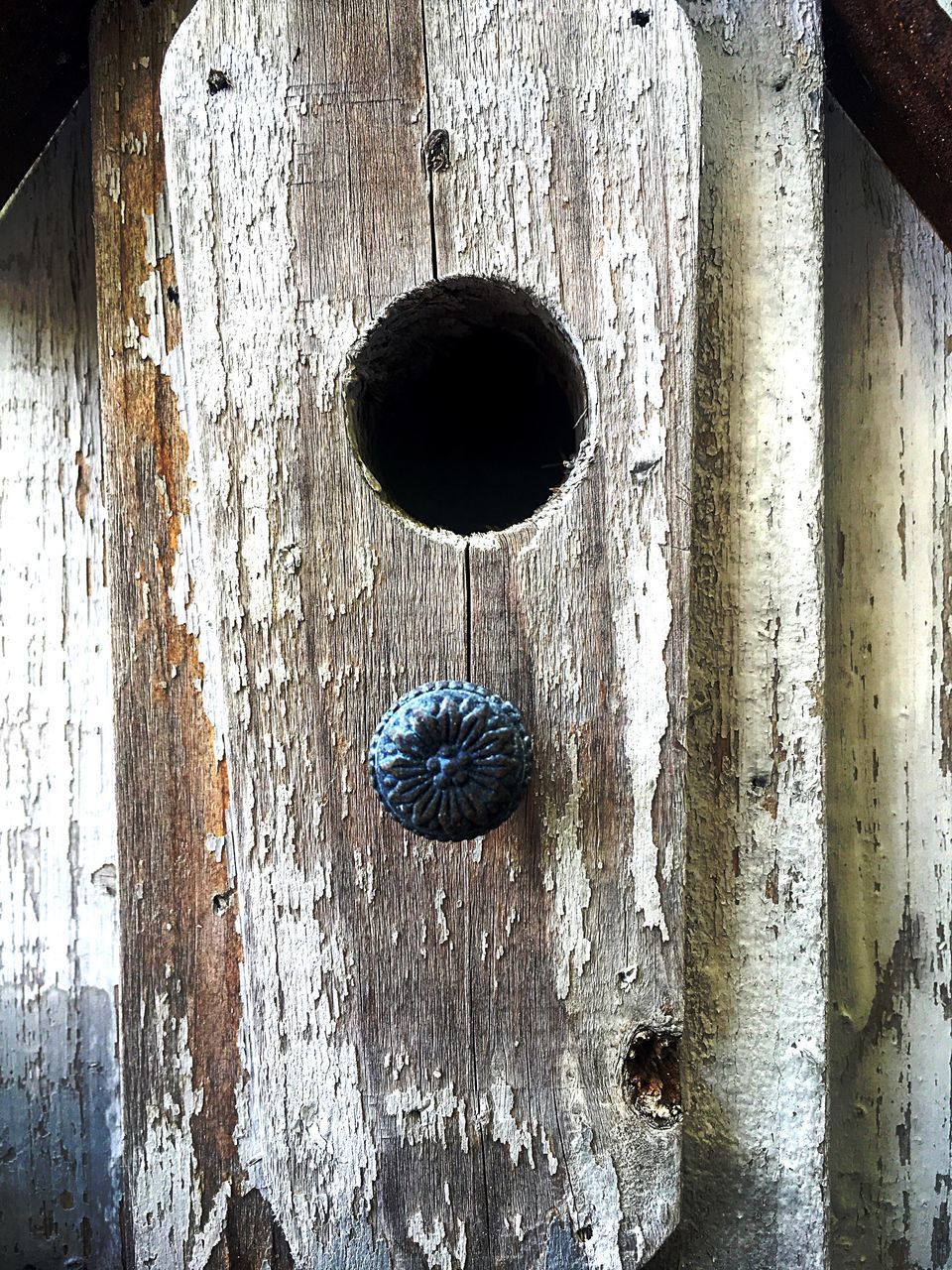 FULL FRAME SHOT OF OLD DOOR WITH METAL GRATE