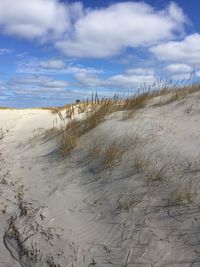 Scenic view of sea against cloudy sky