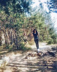 People walking on footpath in forest