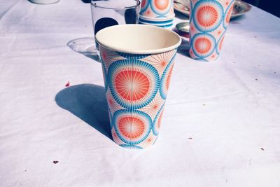 Close-up of disposable drinking glasses on table