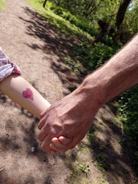 High angle view of man holding hands