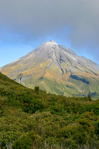 Scenic view of volcanic mountain against sky