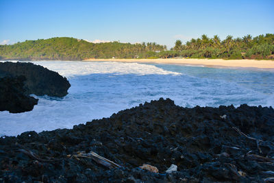 Scenic view of sea against clear sky