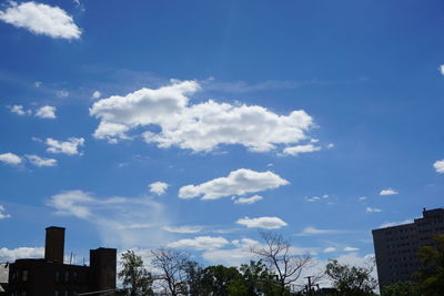 Low angle view of building against cloudy sky