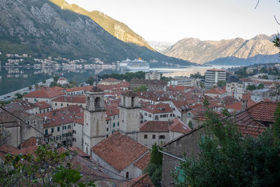 High angle view of townscape and mountains against sky