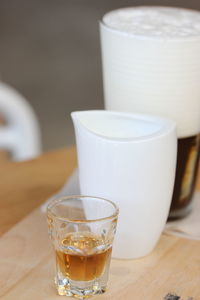 Close-up of coffee in glass on table