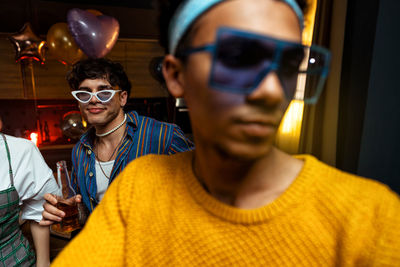 Portrait of young woman wearing sunglasses