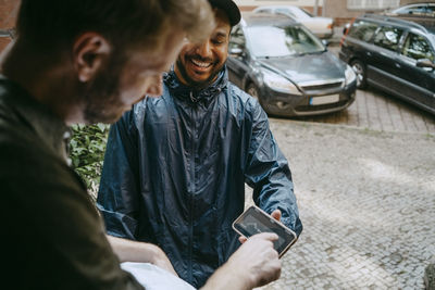 Side view of man using mobile phone