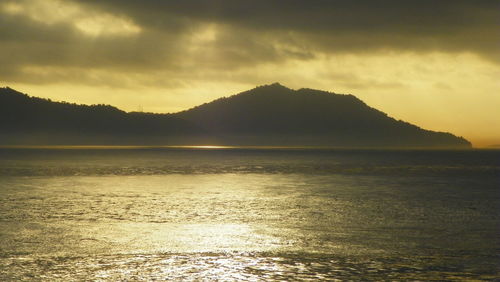 Scenic view of mountains against sky during sunset