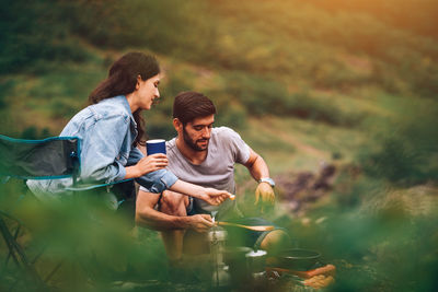 Young couple kissing on land