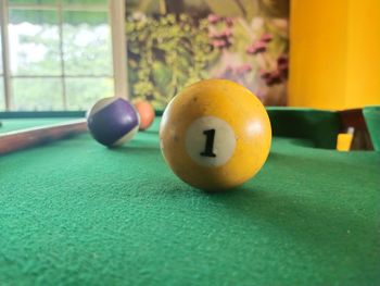 Close-up of pool ball on table