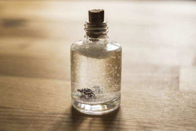 Close-up of bottle on wooden table