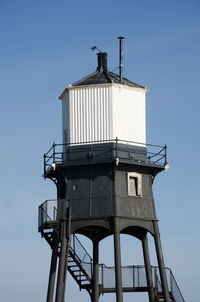 Low angle view of water tower against clear sky