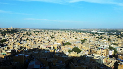 Aerial view of cityscape against sky