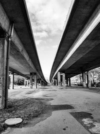 Low angle view of bridge against sky in city