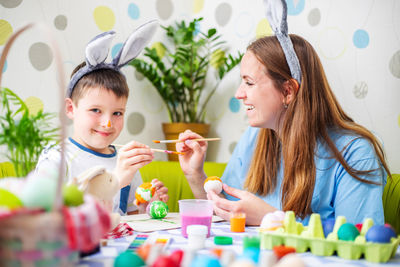 Portrait of smiling girl playing with toys at home