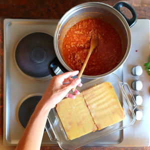 High angle view of woman preparing food in kitchen