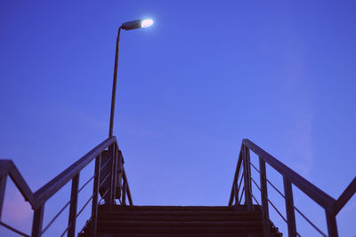 Low angle view of bridge against clear blue sky