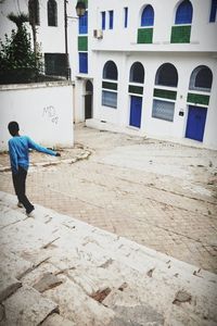Man standing in front of building