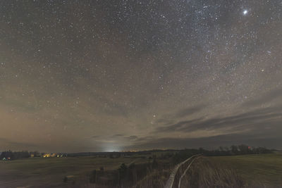 Scenic view of landscape against sky at night