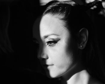 Close-up portrait of woman looking away