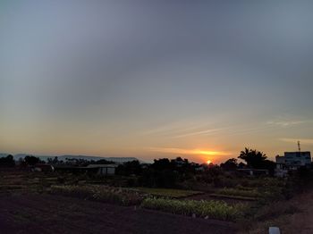 Scenic view of field against sky during sunset