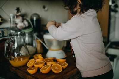 Midsection of girl preparing food