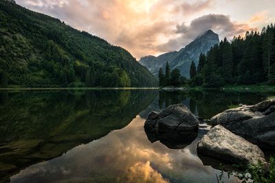 Scenic view of lake and mountains against sky