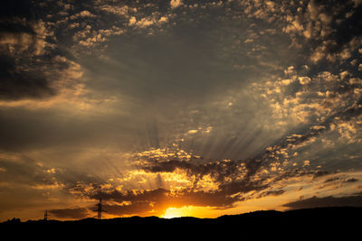 Low angle view of dramatic sky during sunset