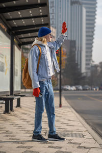 Full length of woman walking on street