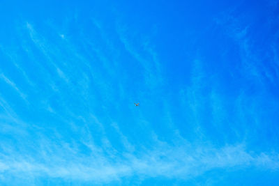 Low angle view of airplane flying in sky