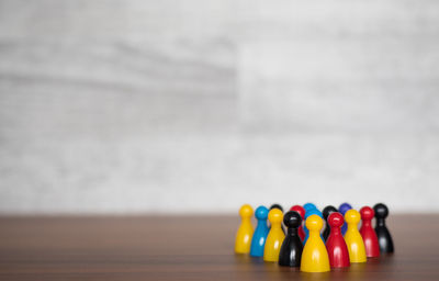 Close-up of colorful tokens on table