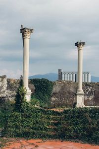 Lighthouse against cloudy sky