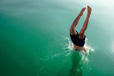 High angle view of man diving in lake