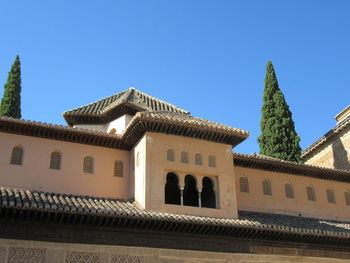 Low angle view of temple against clear blue sky