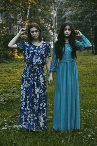 Smiling woman with arms raised