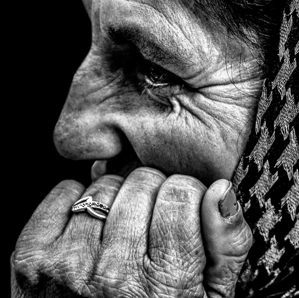 close-up, part of, person, detail, cropped, indoors, studio shot, wrinkled, men, human finger, extreme close up, human face, holding, unrecognizable person, black background, human skin