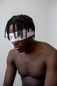 Black man wearing blindfold portrait