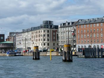 View of buildings against cloudy sky