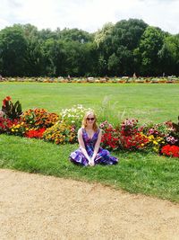 Full length of woman on flower field